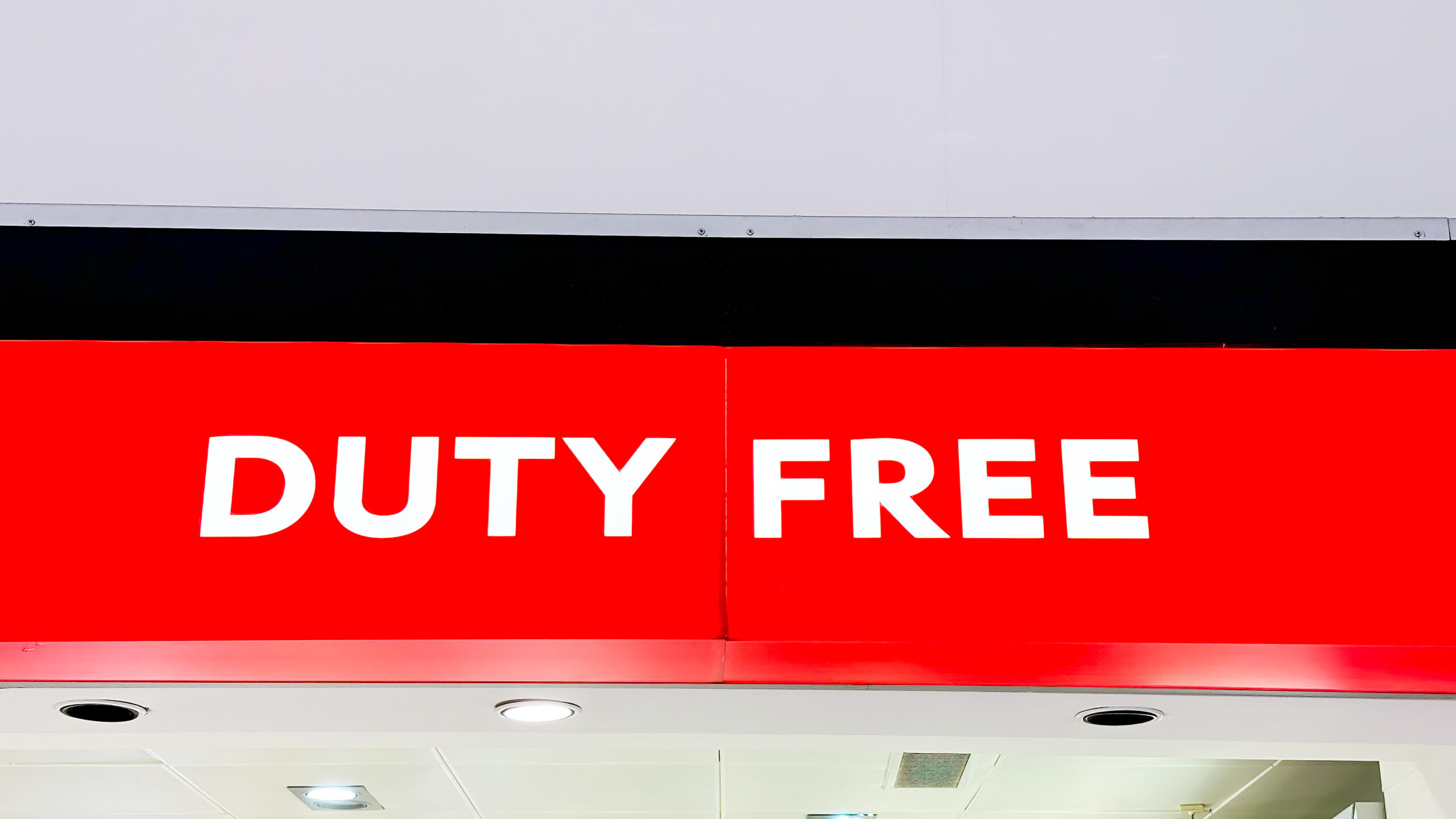Duty free shop sign in an airport terminal, indicating tax-free